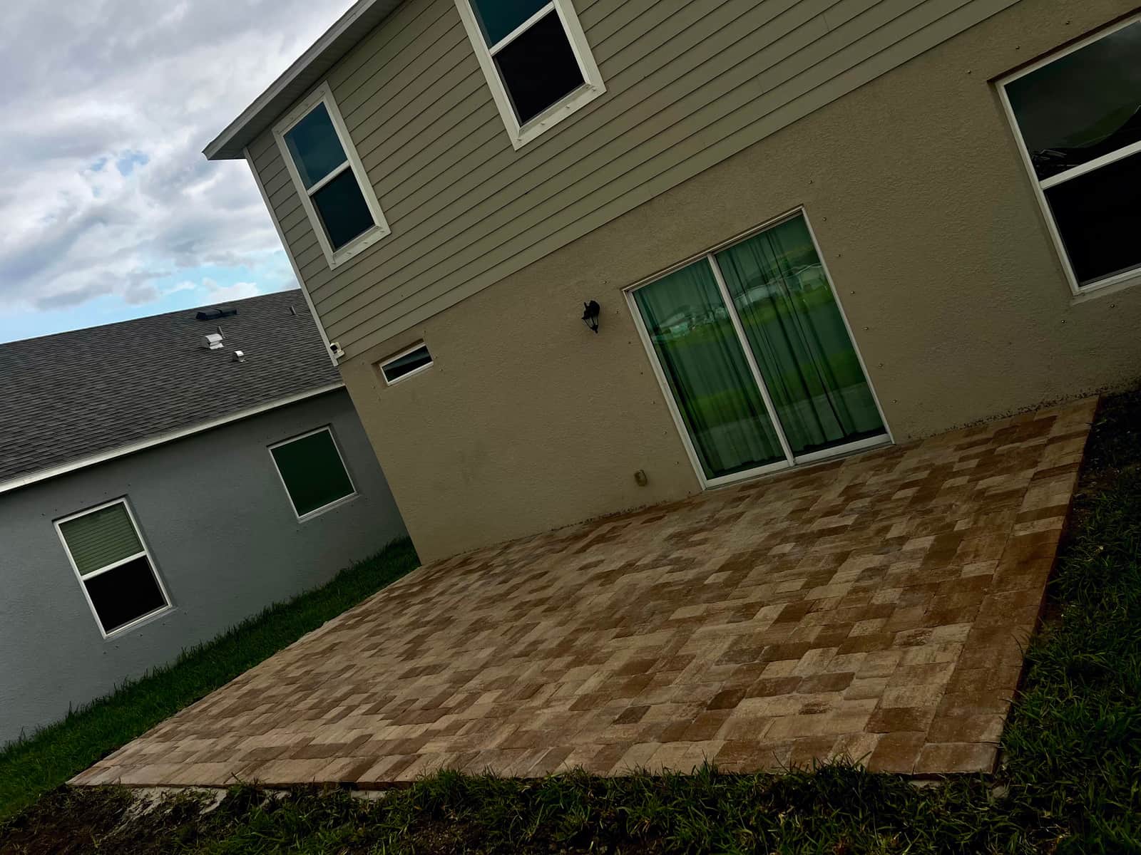 Finished paver patio installed by Prestige Lawns in Palm Bay, FL
